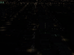 An X-Plane 10 freeway, seen at a distance at night