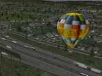 A hot air balloon in the suburbs
