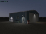 A small hangar, seen at night